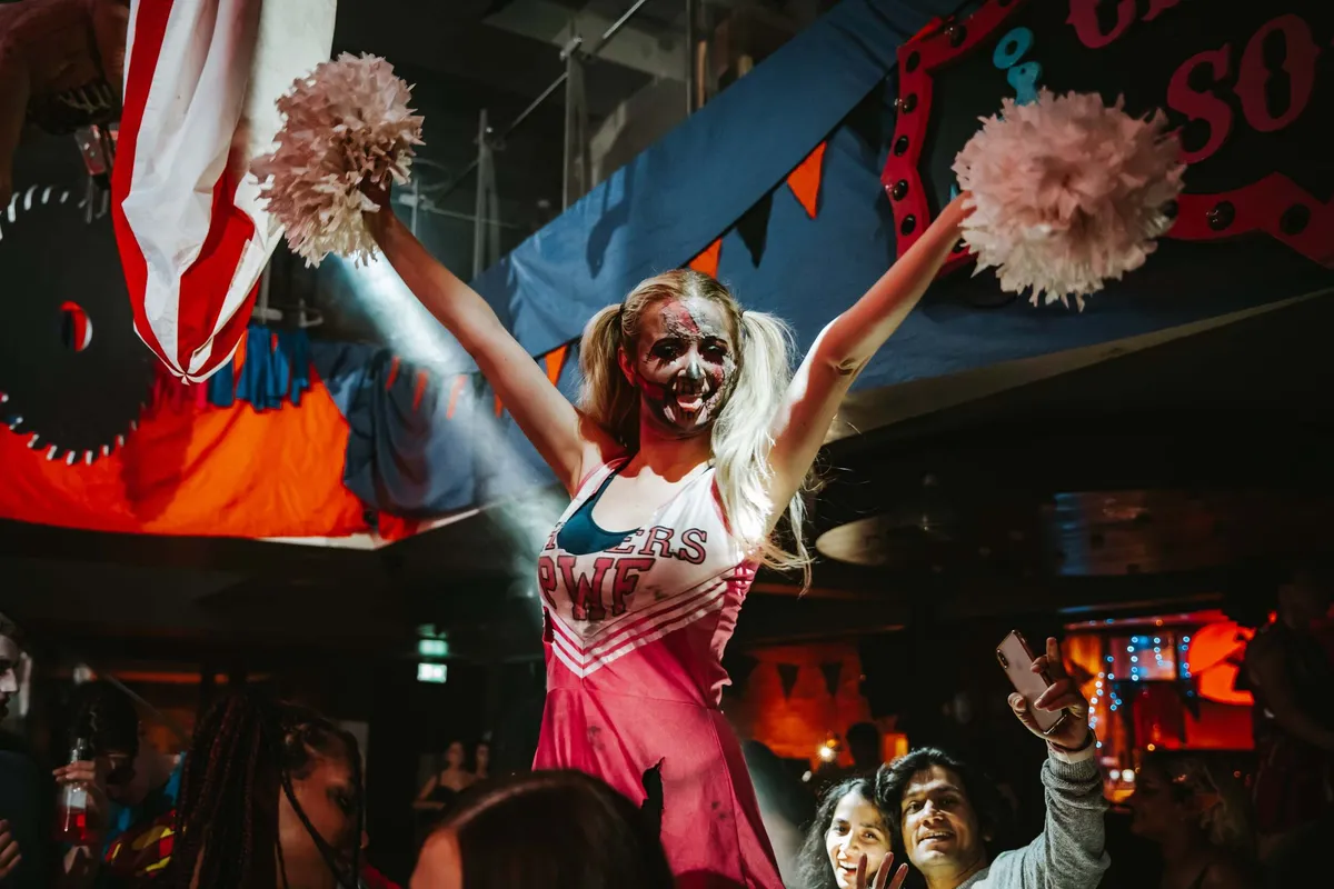 Horror-themed performer on stage at Halloween event