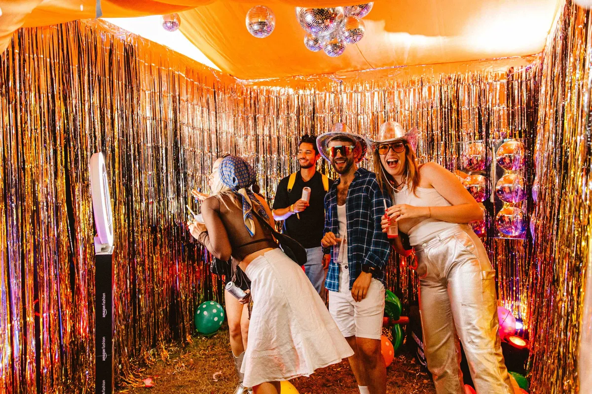 Festival guests enjoying Amazon Fashion Haus immersive experience