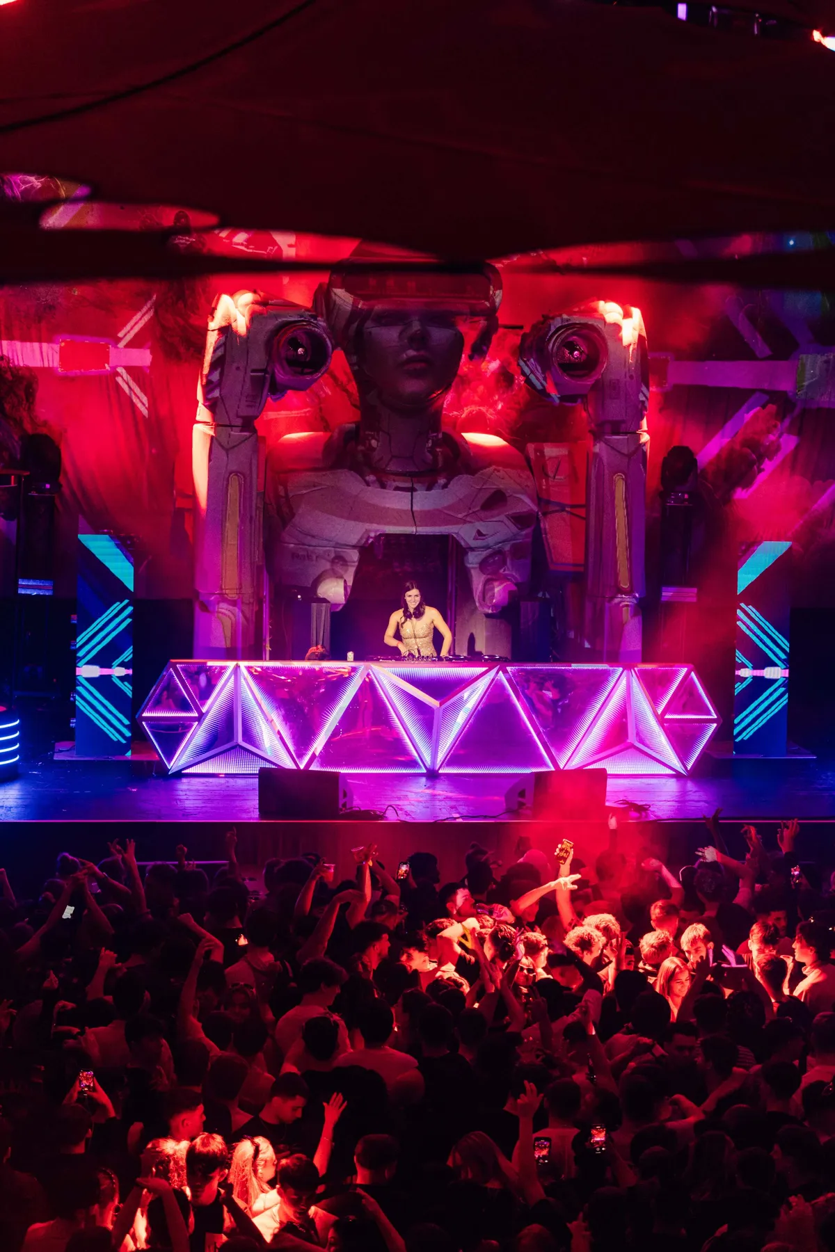 Crowd enjoying futuristic club night experience