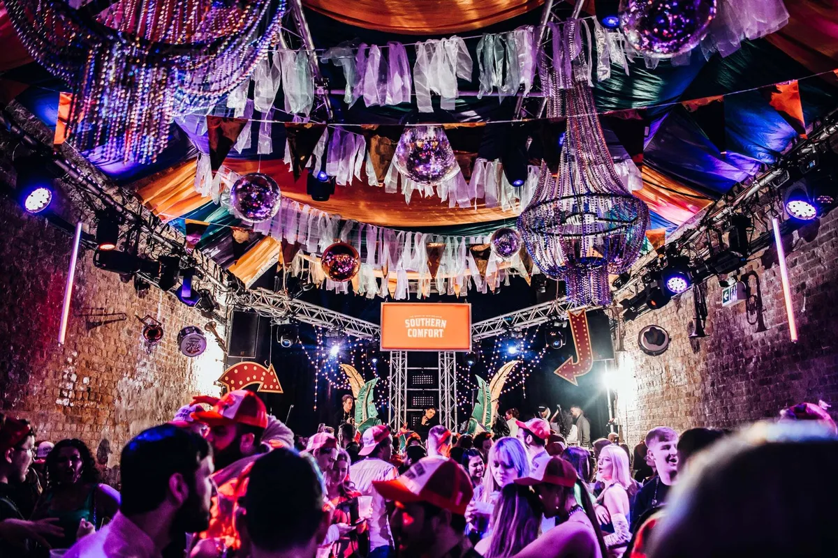 Festival-goers enjoying Mardi Gras nightlife experience