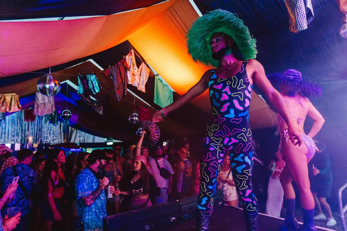 Crowd enjoying music at immersive festival micro-venue