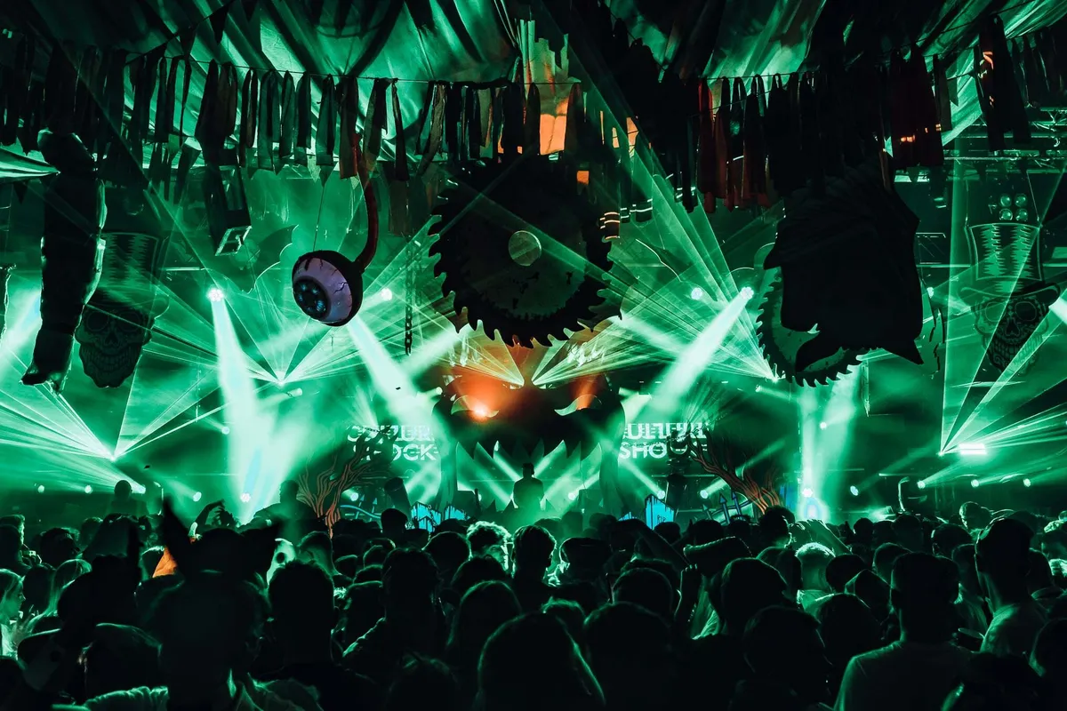 Festival-goers in Halloween costumes and makeup